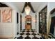 Bright entryway with black and white checkered floor and statement art at 1409 Sheridan Ne Rd, Atlanta, GA 30324