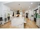 Large kitchen with marble island, white cabinets, and gold hardware at 1409 Sheridan Ne Rd, Atlanta, GA 30324