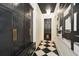 Mudroom with black cabinets, checkered floor, and built-in bench at 1409 Sheridan Ne Rd, Atlanta, GA 30324