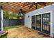 Stone patio with French doors, artificial turf, and a swing at 1409 Sheridan Ne Rd, Atlanta, GA 30324