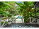 White deck steps lead to refreshing pool, surrounded by lush greenery at 1409 Sheridan Ne Rd, Atlanta, GA 30324