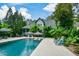 Inviting swimming pool with spacious patio and lush landscaping at 1409 Sheridan Ne Rd, Atlanta, GA 30324