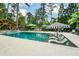 Large rectangular pool with spacious patio, and pergola at 1409 Sheridan Ne Rd, Atlanta, GA 30324