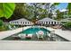 Inviting pool with swim-up seating, umbrellas, and lounge chairs at 1409 Sheridan Ne Rd, Atlanta, GA 30324