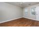 Well-lit bedroom with hardwood floors and ceiling fan at 242 Chads Ford Way, Roswell, GA 30076