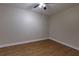 Simple bedroom with light walls and wood-look floors at 242 Chads Ford Way, Roswell, GA 30076