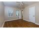 Spacious bedroom with hardwood floors and ceiling fan at 242 Chads Ford Way, Roswell, GA 30076