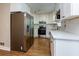 Updated kitchen featuring white cabinets and stainless steel appliances at 242 Chads Ford Way, Roswell, GA 30076