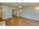 Spacious living room with hardwood floors and ceiling fan at 242 Chads Ford Way, Roswell, GA 30076