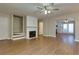 Living room with hardwood floors, fireplace, and access to kitchen at 242 Chads Ford Way, Roswell, GA 30076