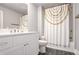 Modern bathroom with white vanity and a shower/tub combo at 308 Gibson Se St, Atlanta, GA 30316