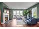 Spacious living room featuring a fireplace and large windows at 308 Gibson Se St, Atlanta, GA 30316