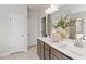 Double vanity bathroom with large mirror and modern decor at 51 Bennett Farm Dr, Loganville, GA 30052