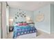 Charming bedroom with light blue walls and unique decor at 51 Bennett Farm Dr, Loganville, GA 30052