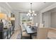 Formal dining room with a large window and view of the backyard at 51 Bennett Farm Dr, Loganville, GA 30052