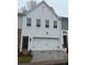 Modern two-story home with white brick exterior and a two-car garage at 3309 Cranston Ln, Kennesaw, GA 30144