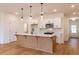 Modern kitchen with island, stainless steel appliances, and white cabinets at 3309 Cranston Ln, Kennesaw, GA 30144