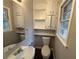 Updated half bathroom with new vanity and storage at 4515 Wonder Valley Trl, Decatur, GA 30034