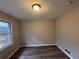 Cozy bedroom with large window and new flooring at 4515 Wonder Valley Trl, Decatur, GA 30034