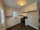 Updated kitchen features white cabinets, new flooring, and modern appliances at 4515 Wonder Valley Trl, Decatur, GA 30034