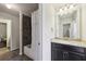 Dark-tiled bathroom with granite countertop and a shower/tub combo at 1240 Roswell Manor Cir, Roswell, GA 30076