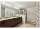 Bathroom with double vanity, granite countertop and shower at 1240 Roswell Manor Cir, Roswell, GA 30076