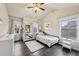 Bright bedroom with hardwood floors and plenty of natural light at 1240 Roswell Manor Cir, Roswell, GA 30076