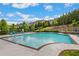 Inviting community pool with lounge chairs and umbrellas at 1240 Roswell Manor Cir, Roswell, GA 30076