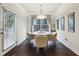 Bright dining room with hardwood floors and a view to the backyard at 1240 Roswell Manor Cir, Roswell, GA 30076