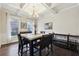 Bright dining room featuring hardwood floors and a granite table at 1240 Roswell Manor Cir, Roswell, GA 30076