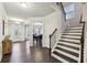 Bright and spacious entryway with hardwood floors and staircase at 1240 Roswell Manor Cir, Roswell, GA 30076