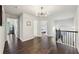 Upstairs hallway with hardwood floors and access to bedrooms at 1240 Roswell Manor Cir, Roswell, GA 30076