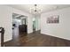 Upper hallway with hardwood floors, leading to bedrooms and bonus area at 1240 Roswell Manor Cir, Roswell, GA 30076