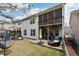 Two-story house with a screened porch and backyard at 1240 Roswell Manor Cir, Roswell, GA 30076