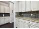 Well-appointed kitchen pantry with granite countertops and shaker-style cabinets at 1240 Roswell Manor Cir, Roswell, GA 30076