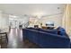 Open concept living room with hardwood floors and a view into the kitchen at 1240 Roswell Manor Cir, Roswell, GA 30076