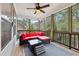 Screened porch with wooden floors and comfortable seating at 1240 Roswell Manor Cir, Roswell, GA 30076