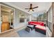 Screened porch with red couch and access to the house at 1240 Roswell Manor Cir, Roswell, GA 30076