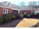 Brick home with deck and landscaping in the backyard at 1420 Arblay Pl, Loganville, GA 30052