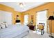 Cozy bedroom with yellow walls and rocking chair at 1420 Arblay Pl, Loganville, GA 30052