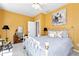 Cozy bedroom featuring a comfortable bed, and warm, inviting yellow walls at 1420 Arblay Pl, Loganville, GA 30052