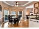 Charming breakfast nook with a round table and chairs, near the kitchen at 1420 Arblay Pl, Loganville, GA 30052