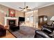 Living room with fireplace, hardwood floors, and comfortable seating at 1420 Arblay Pl, Loganville, GA 30052