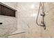 Elegant shower with marble tile and built-in seat at 1420 Arblay Pl, Loganville, GA 30052