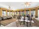 Bright sunroom with seating area and dining table at 1420 Arblay Pl, Loganville, GA 30052