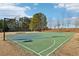 Outdoor community basketball court with two hoops and seating at 5034 Hickory Hills Dr, Woodstock, GA 30188