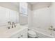 Clean bathroom with white tile and updated fixtures at 5034 Hickory Hills Dr, Woodstock, GA 30188