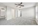 Bedroom with grey carpet, a closet and hallway access at 5034 Hickory Hills Dr, Woodstock, GA 30188