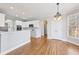 Bright breakfast area with hardwood floors and a view of the backyard at 5034 Hickory Hills Dr, Woodstock, GA 30188