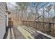 Deck with wooden railings and wooded backdrop at 5034 Hickory Hills Dr, Woodstock, GA 30188